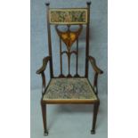 An Arts & Crafts mahogany and satinwood inlaid armchair with stylised motifs to the back splat in