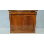 A Regency mahogany chiffonier with panel doors enclosing shelved interior on plinth base. H.90 W.103