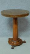 A 19th century mahogany circular occasional table raised on pedestal base. H.74 L.57 W.57cm