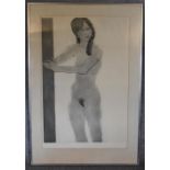 A framed and glazed artist's proof, 'Woman in a Doorway' framed and glazed, signed by Kathan Brown