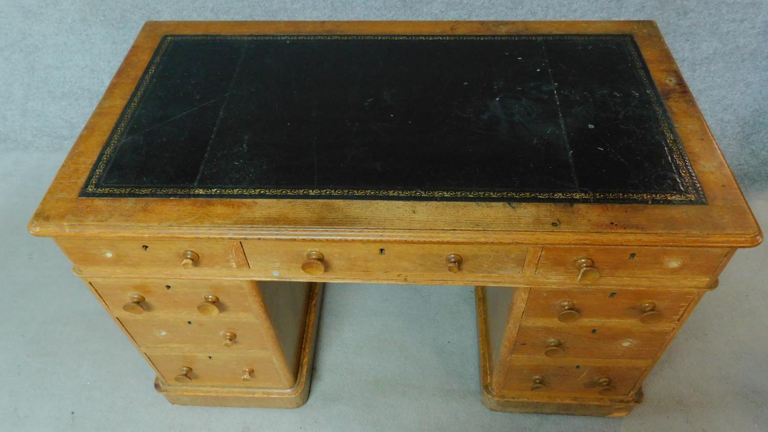 A 19th century oak leather top desk with central long frieze drawer and eight short drawers. H.75 - Image 3 of 8