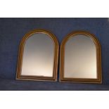 A pair of Victorian style arched gilt mantel mirrors. H.80 x 60cm