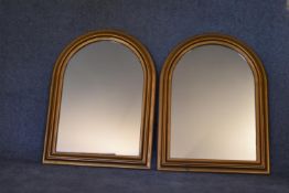 A pair of Victorian style arched gilt mantel mirrors. H.80 x 60cm