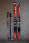 A pair of Atomic Pro lightweight skis, ski sticks and carrying holdall. H.145cm