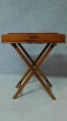 A Georgian Cuban mahogany butler's tray with folding stand. H.81 W.71 D.46cm