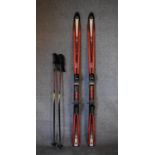 A pair of Tecno Pro lightweight skis, ski sticks and carrying holdall. L.167cm