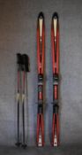 A pair of Tecno Pro lightweight skis, ski sticks and carrying holdall. L.167cm