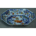 A transfer design oriental handled serving dish. Printed artists seal to base. Decorated with floral