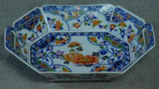 A transfer design oriental handled serving dish. Printed artists seal to base. Decorated with floral