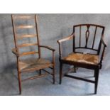 An antique beech ladder back rush seated armchair and a similar oak chair. H.102cm