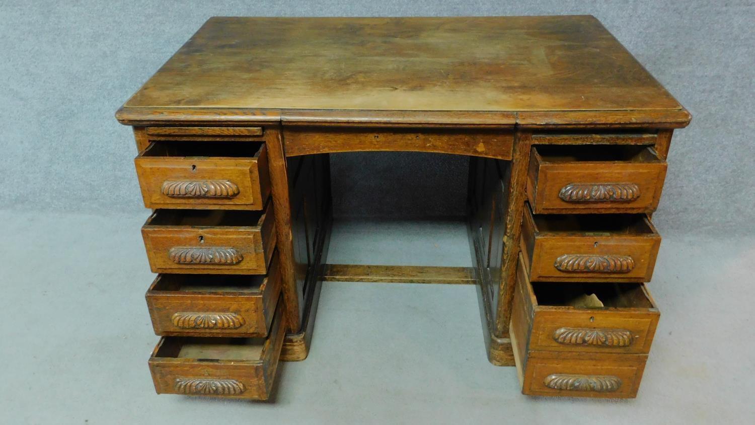 A 19th Century oak desk with eight short drawers on plinth base. H.77 W.126 D.81cm - Image 3 of 5