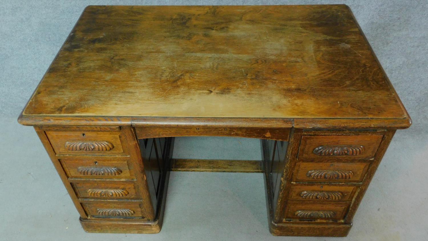 A 19th Century oak desk with eight short drawers on plinth base. H.77 W.126 D.81cm - Image 2 of 5