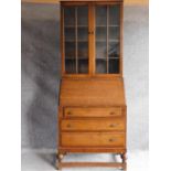 A mid 20th century oak bureau bookcase. H.190 W.80 D.47cm
