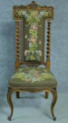 A Victorian rosewood floral carved and upholstered prie dieu chair raised on cabriole legs. H.111cm