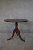 A 19th century oak circular occasional table on tripod cabriole supports. H.52 x 60cm