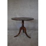 A 19th century oak circular occasional table on tripod cabriole supports. H.52 x 60cm