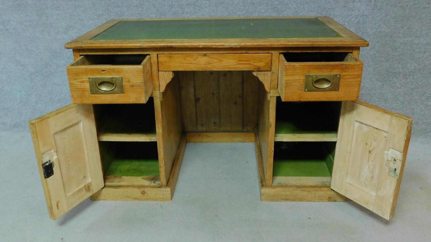 A 19th century pitch pine desk with leather top and two short drawers over panel doors enclosing - Image 3 of 6