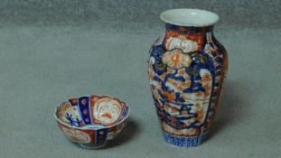 A hand painted oriental porcelain vase and fluted bowl. With gilded details and floral design. H.