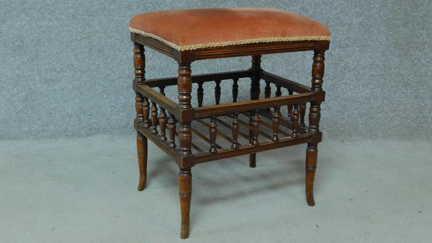 A 19th century walnut piano stool with fitted undertier for sheet music. H.55 W.46 D.36cm