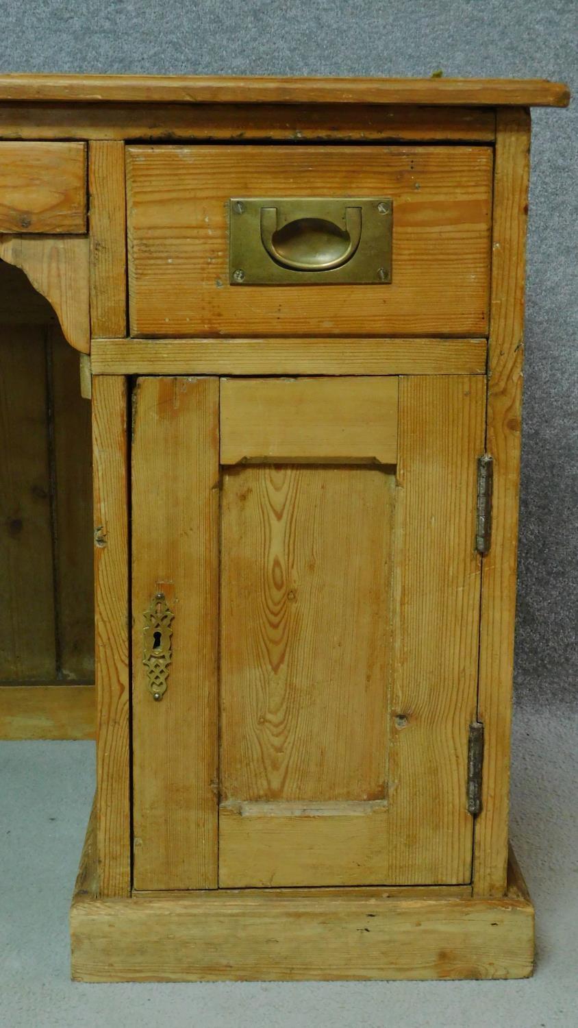 A 19th century pitch pine desk with leather top and two short drawers over panel doors enclosing - Image 4 of 6