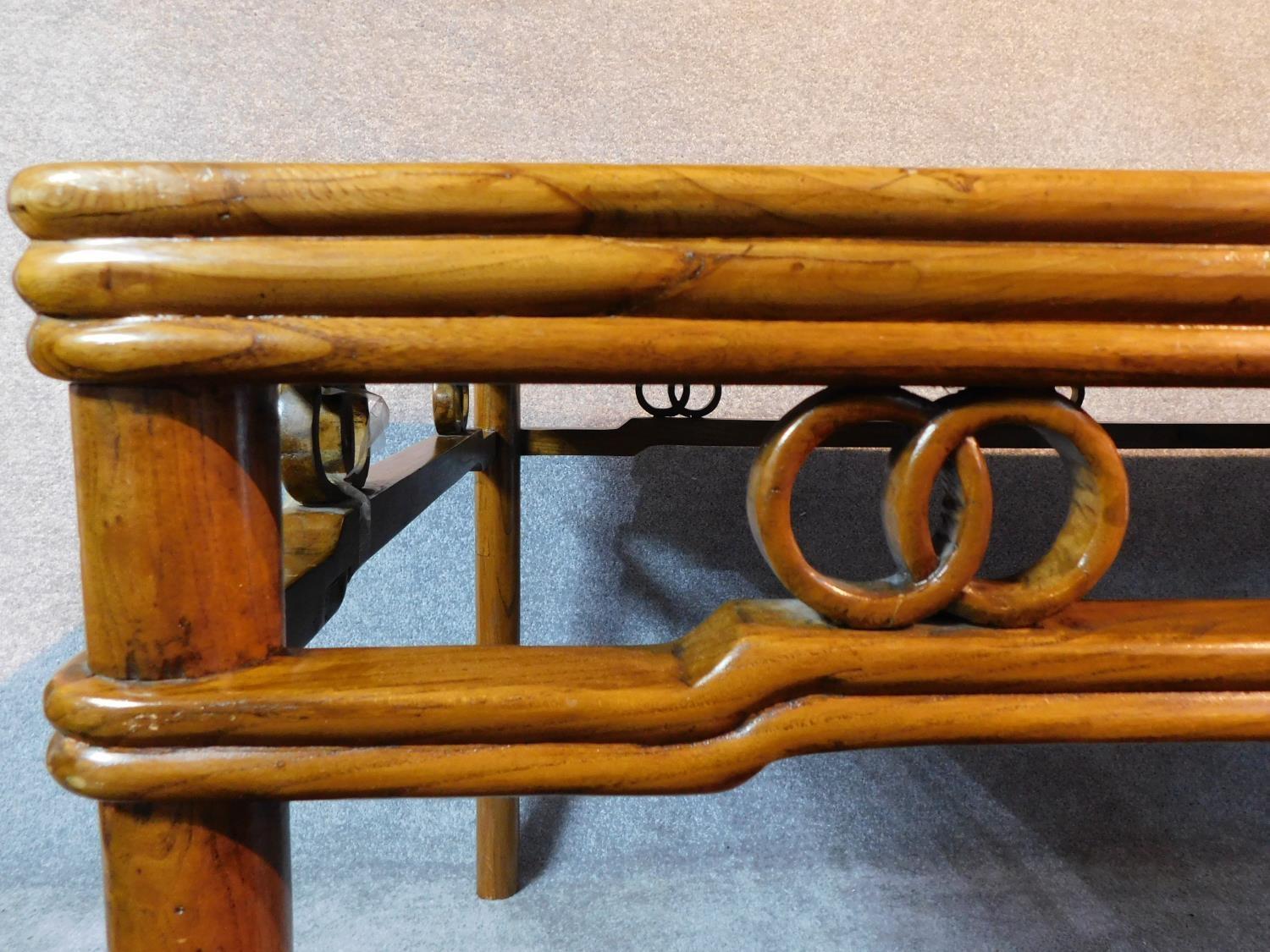 A Chinese hardwood rattan topped dining table raised on circular section supports. Possibly retailed - Image 3 of 7