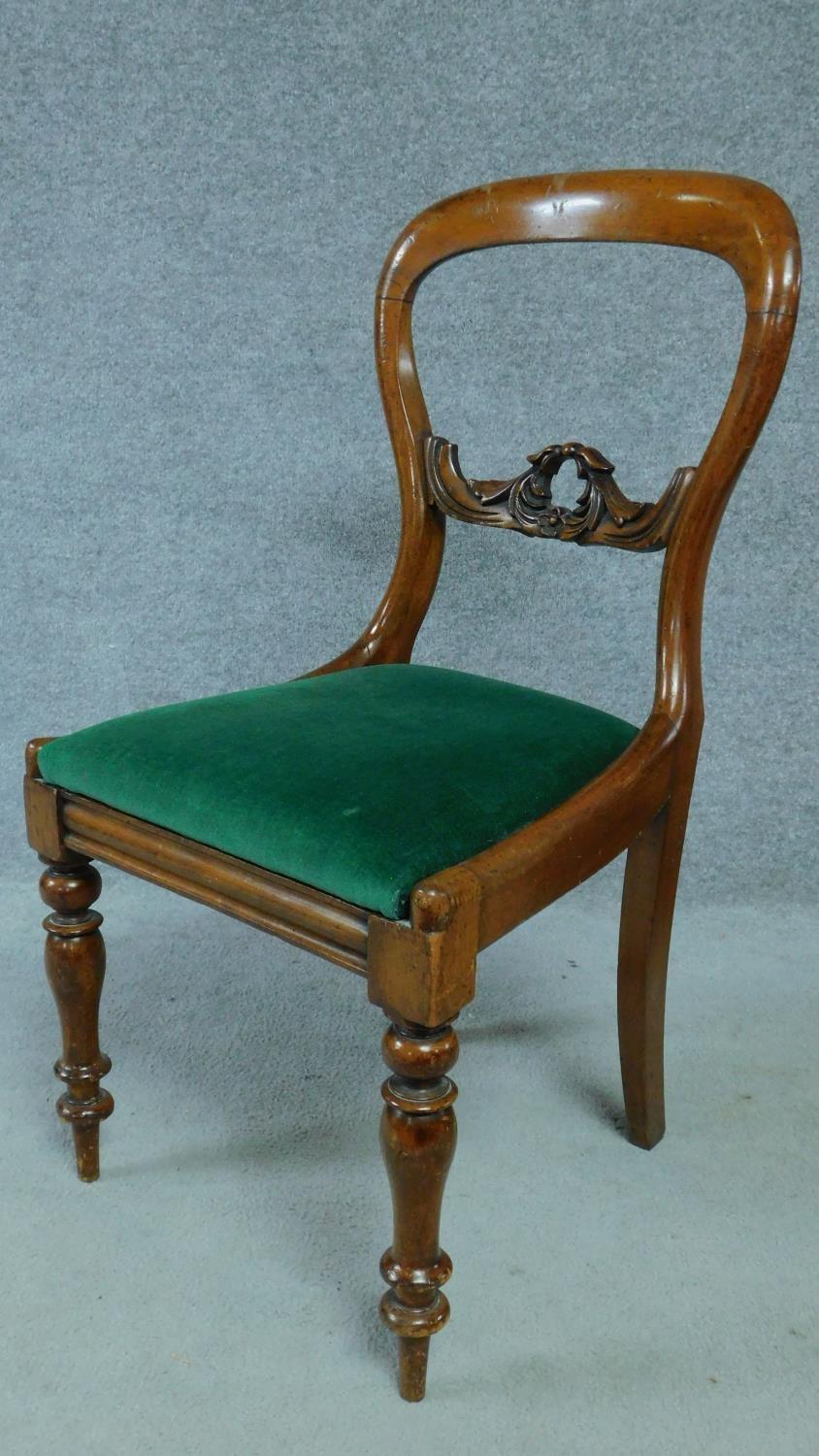 A set of four Victorian mahogany balloon back dining chairs on turned tapering supports. H.87cm - Image 2 of 4