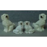 Two pairs of Staffordshire style porcelain dogs. One pair are large. With gilded detailing. H.38cm