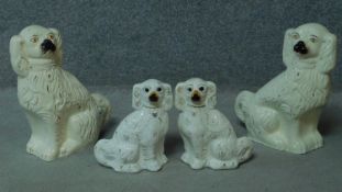 Two pairs of Staffordshire style porcelain dogs. One pair are large. With gilded detailing. H.38cm