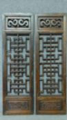 A pair of Chinese hardwood pierced carved panels. 100x31cm