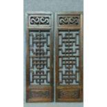 A pair of Chinese hardwood pierced carved panels. 100x31cm