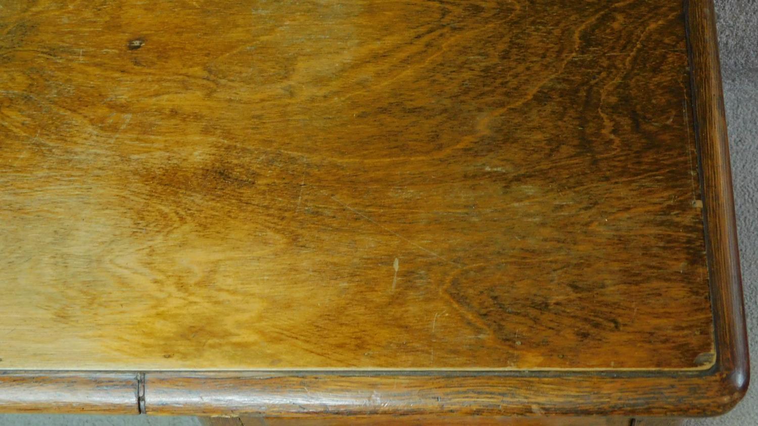 A 19th Century oak desk with eight short drawers on plinth base. H.77 W.126 D.81cm - Image 5 of 5