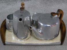 A vintage Picquot ware tea set and tray, metal salt and pepper shakers and sugar bowl. All the