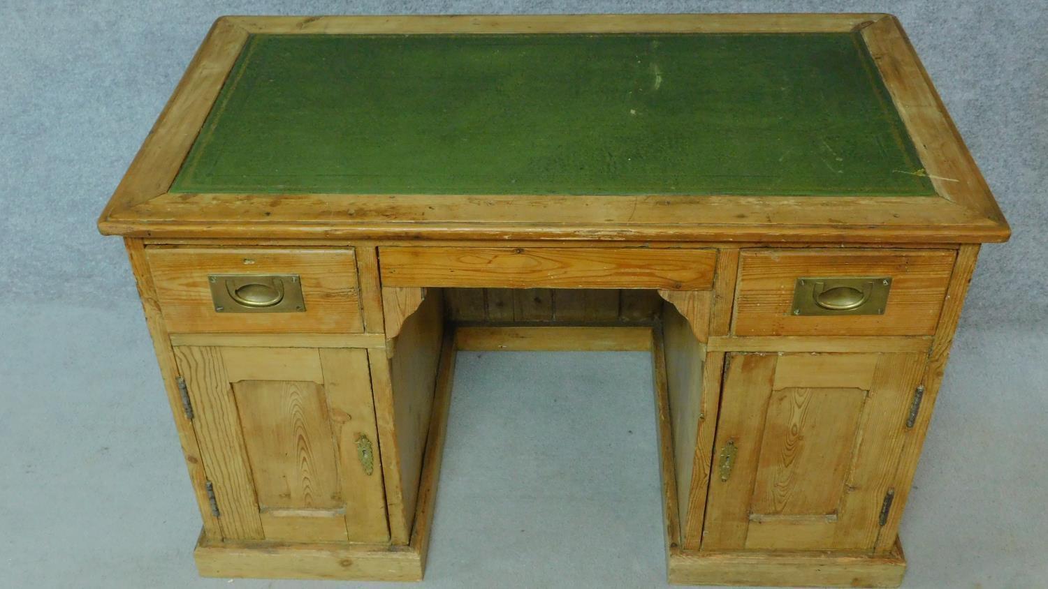 A 19th century pitch pine desk with leather top and two short drawers over panel doors enclosing - Image 2 of 6