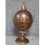 An antique copper and brass two handled samovar. H.55cm