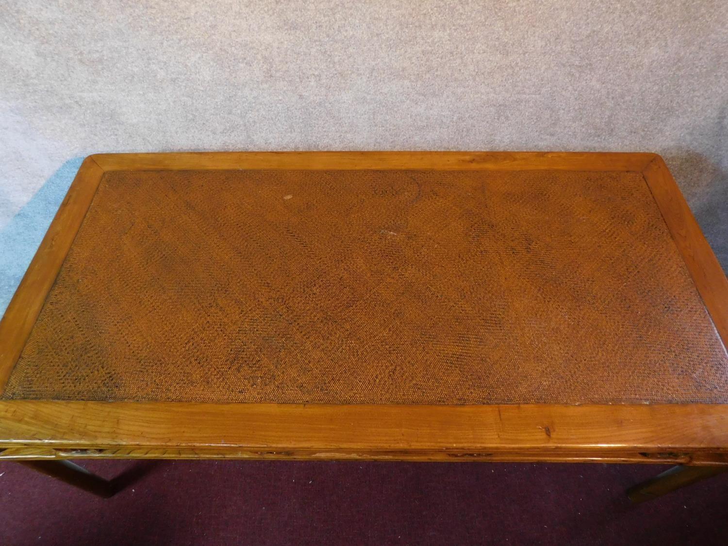 A Chinese hardwood rattan topped dining table raised on circular section supports. Possibly retailed - Image 2 of 7