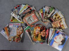 A large collection of vintage Vogue, Private Eye, The Face and House and Garden magazines. 30x24cm