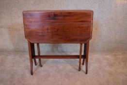 An Edwardian mahogany and satinwood banded drop flap Sutherland table. H.69 x 20cm (ext.80cm)