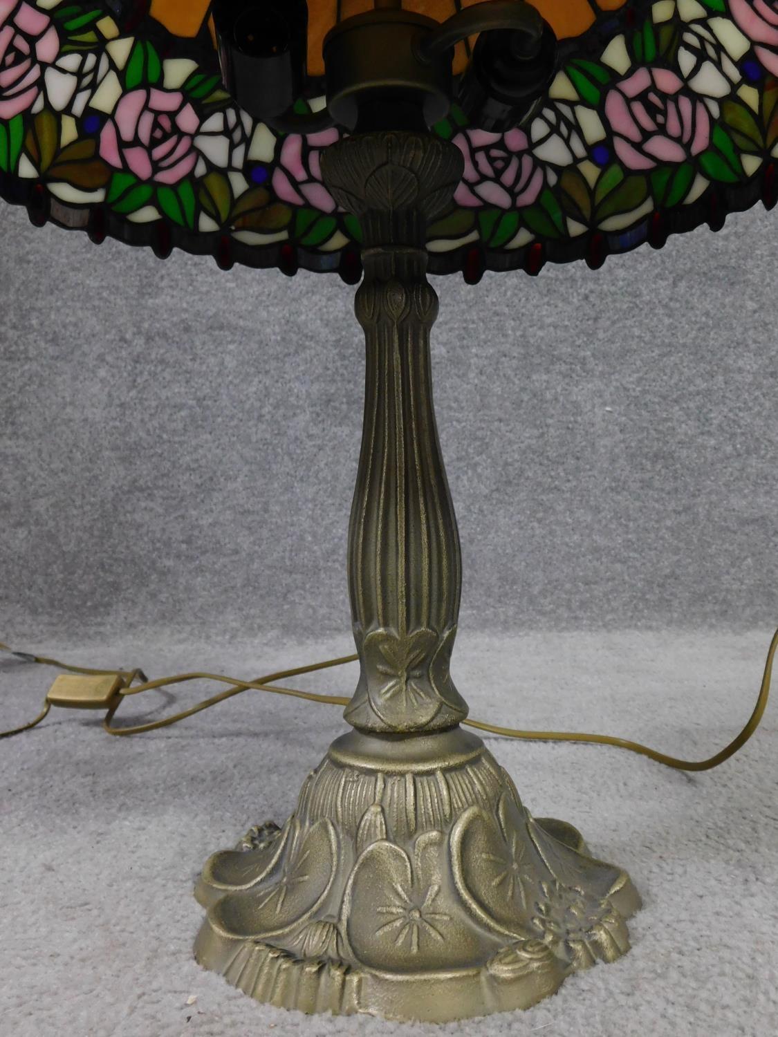 A pair of Tiffany style coloured glass table lamps. Shades have rose and foliate design and the - Image 3 of 3