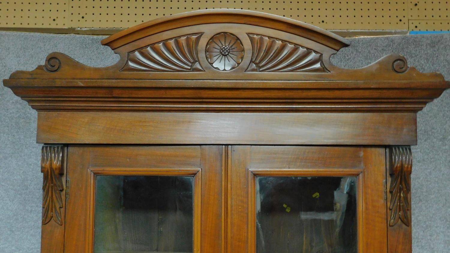 A late 19th century mahogany bookcase with glazed doors above frieze drawer above panel doors - Image 4 of 4