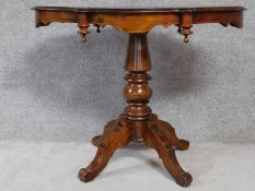 A Continental birch centre table on quadruped pedestal base. H.78 W.100 D.58cm