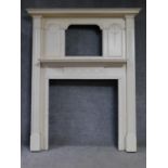 A white painted Adam style fire surround with ribbon and swag decoration. 193x155cm