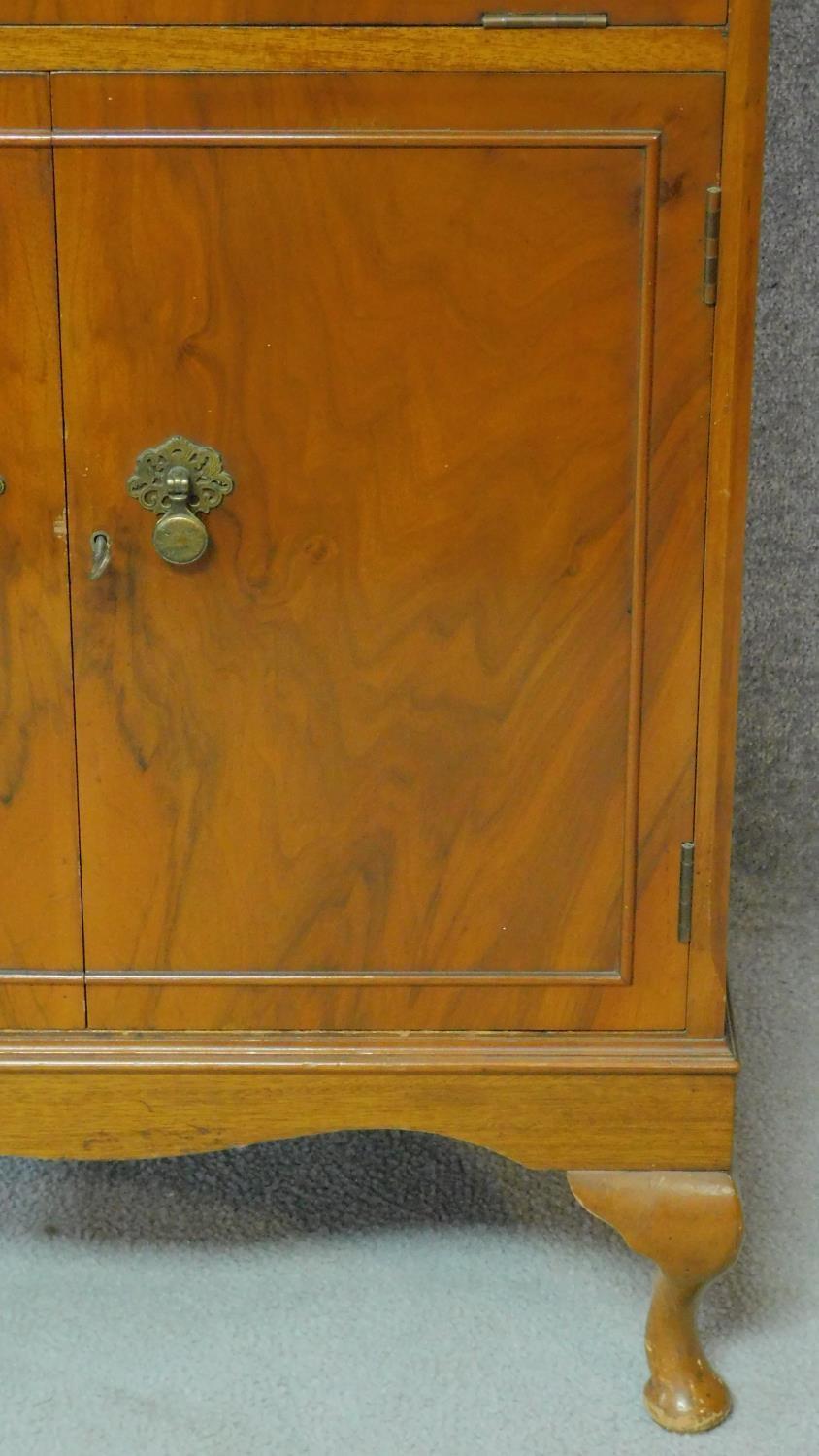 A Georgian style figured walnut cocktail cabinet fitted with mirrored interior raised on cabriole - Image 4 of 7