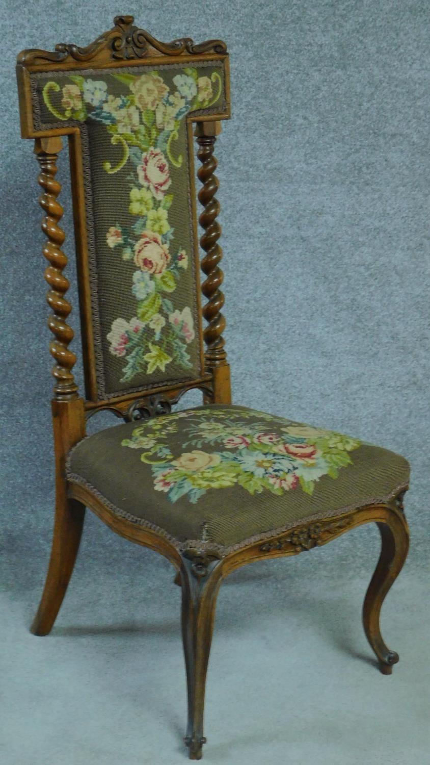 A Victorian rosewood floral carved and upholstered prie dieu chair raised on cabriole legs. H.111cm - Image 2 of 5
