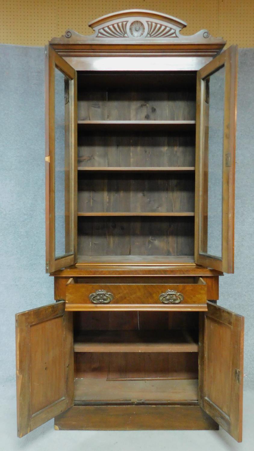 A late 19th century mahogany bookcase with glazed doors above frieze drawer above panel doors - Image 2 of 4