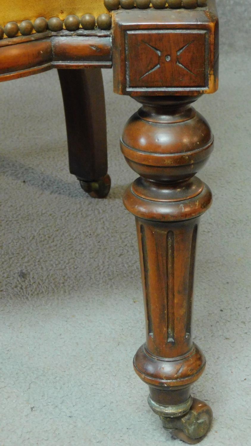 A late 19th century mahogany framed leather upholstered buttoned back library tub armchair on turned - Image 5 of 6