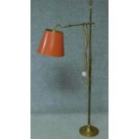 A vintage brass adjustable floor lamp on pedestal base. H.138cm