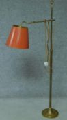 A vintage brass adjustable floor lamp on pedestal base. H.138cm