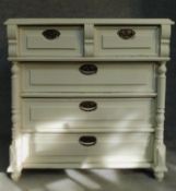 A 19th century continental painted chest of two short over three long drawers flanked by turned