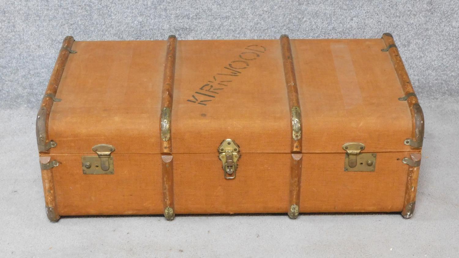 A teak bound and canvas covered Kirkwood travelling trunk fitted with lift out tray. H.30xW.90xD.