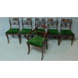 A set of five Regency mahogany dining chairs on sabre supports together with a Regency style